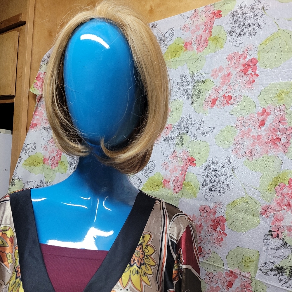 Used-light honey blonde bob with layers.